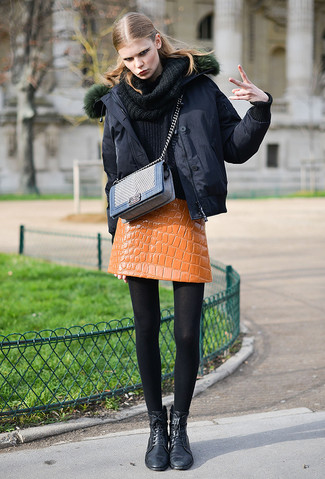 Rustic Charm: Burnt Orange Puffer with Denim Skirt and Boots
