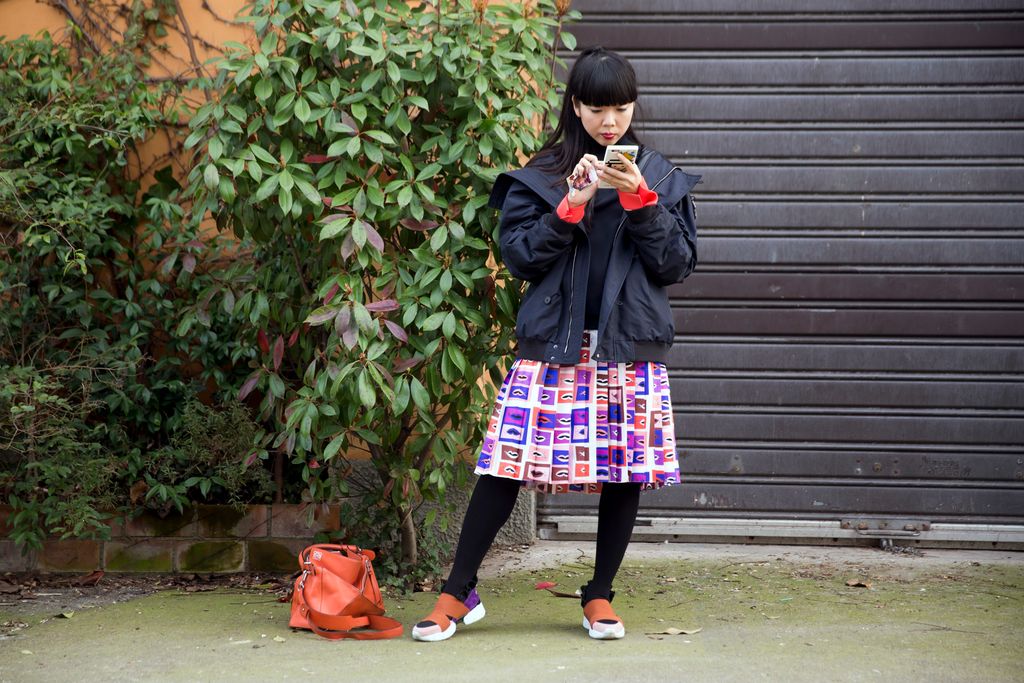 Image may contain Clothing Apparel Susanna Lau Human Person Footwear Shoe Skirt Plaid Tartan Female and Kilt