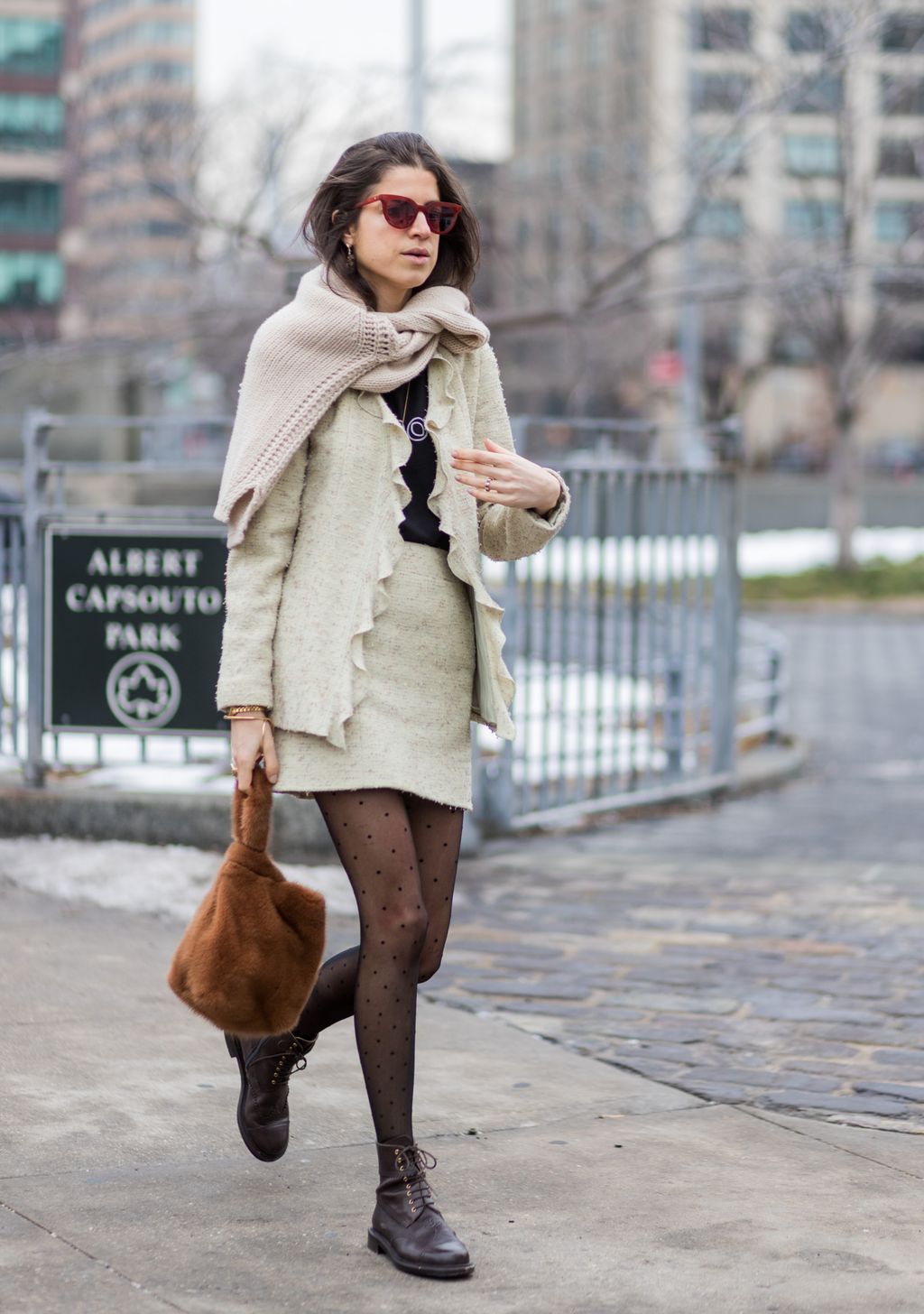 Image may contain Coat Clothing Apparel Sunglasses Accessories Accessory Pants Human Person Footwear and Sleeve