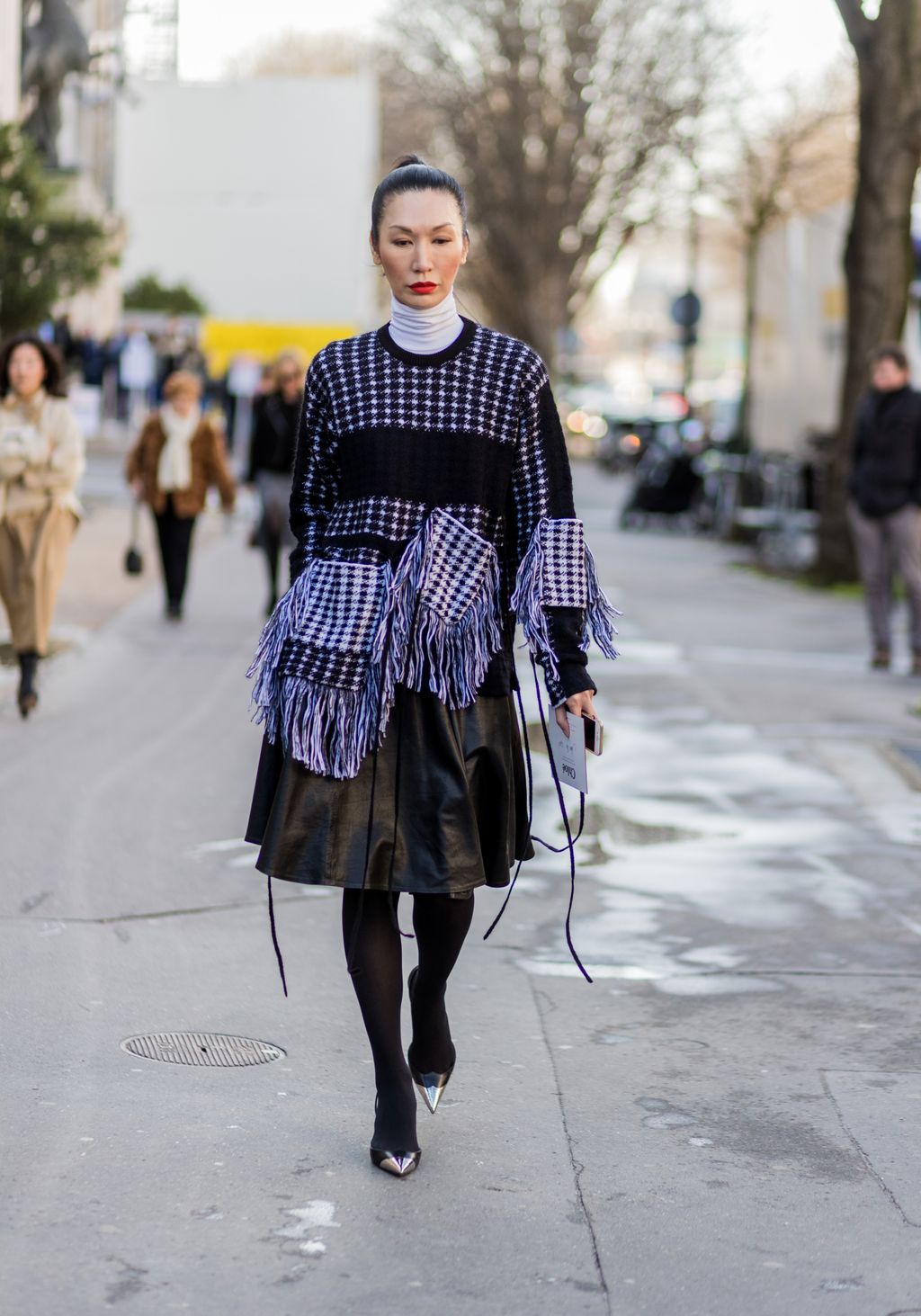 Image may contain Clothing Apparel Human Person Sleeve Long Sleeve Female Footwear Road and Woman