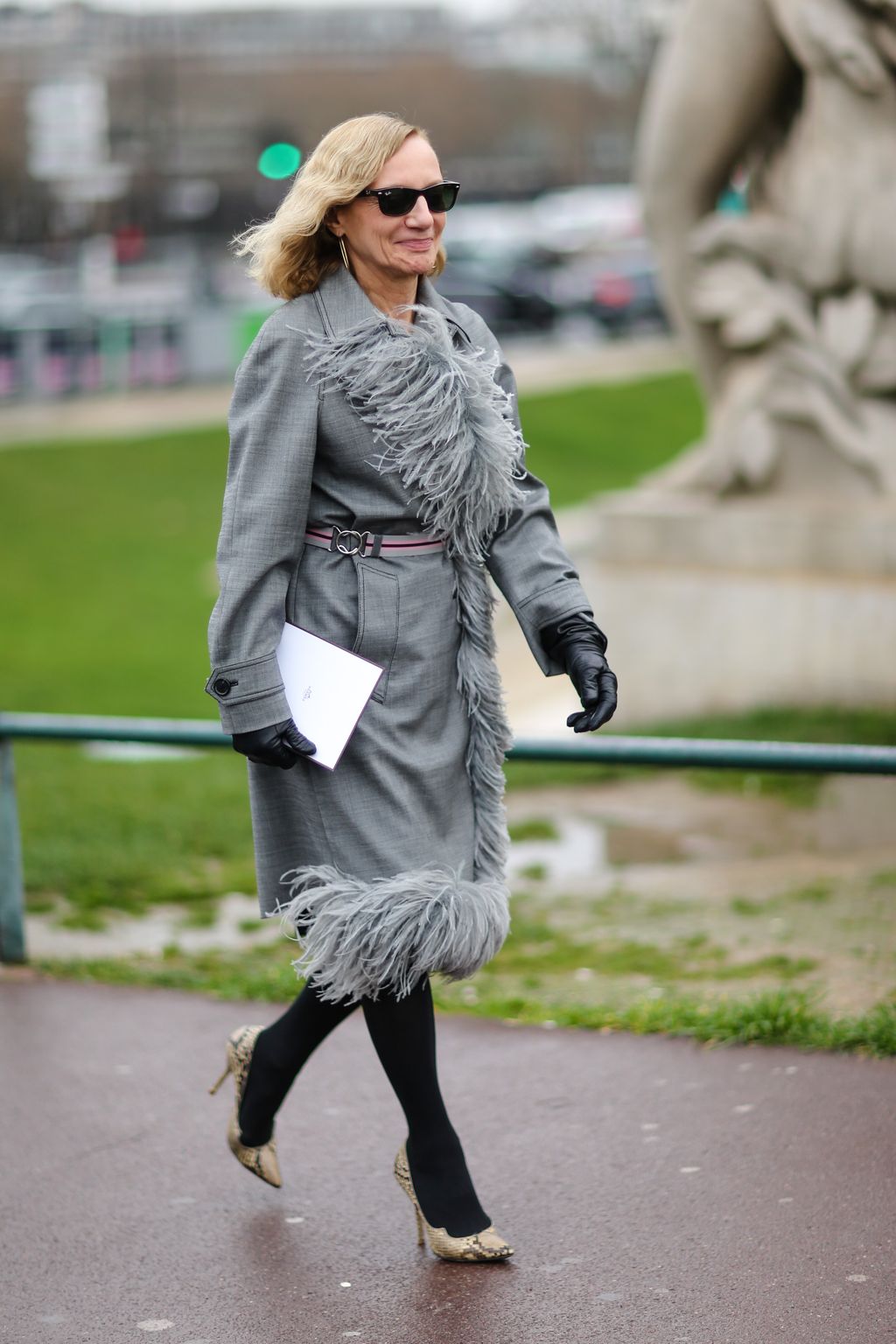 Image may contain Clothing Apparel Sunglasses Accessories Accessory Footwear Human Person Shoe Female and Coat