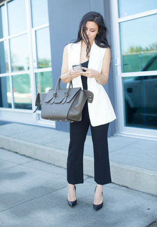 Power Play: White Sleeveless Blazer with Tailored Black Pants