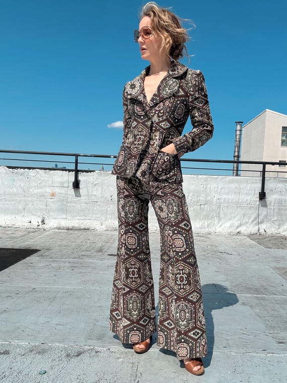 Retro Vibes: Light Brown Jacket Styled with High-Waisted Pants